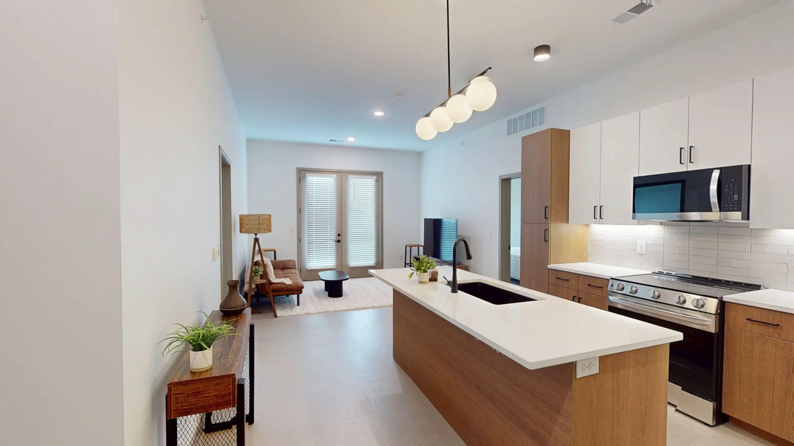 Living Room + Kitchen • 2 Bedroom Unit